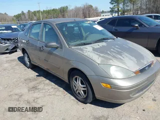 2003 Ford Focus SE z VIN 1FAFP34Z23W272783, wystawiony jako IAAI lot #41620918 z przebiegiem 204 626 mil mil oraz . Historia ofert i sprzedaży dostępna na DreamBid. Obrazek 1.