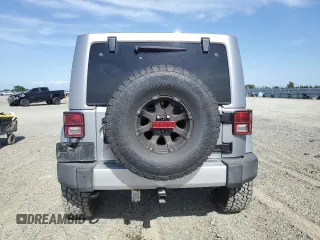 2014 Jeep Wrangler Unlimited Sahara with VIN 1C4HJWEG1EL126611, listed as a Copart auction lot 57169485 with 122,000 mi miles and Salvage title. Bid and sale history available at DreamBid. Image 6.