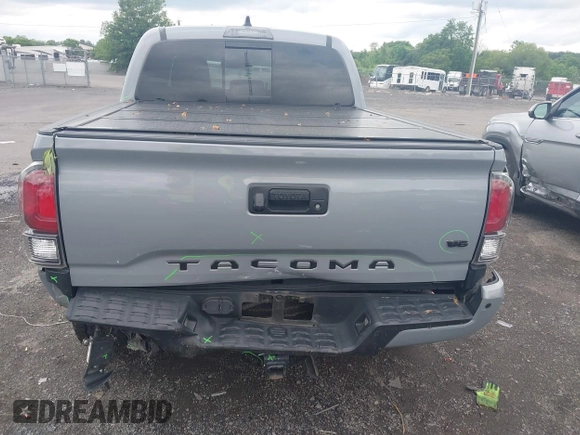 2021 Toyota Tacoma SR with VIN 5TFCZ5AN3MX258746, listed as a IAAI auction lot 42252967 with 62,095 mi miles and . Bid and sale history available at DreamBid. Image 6.