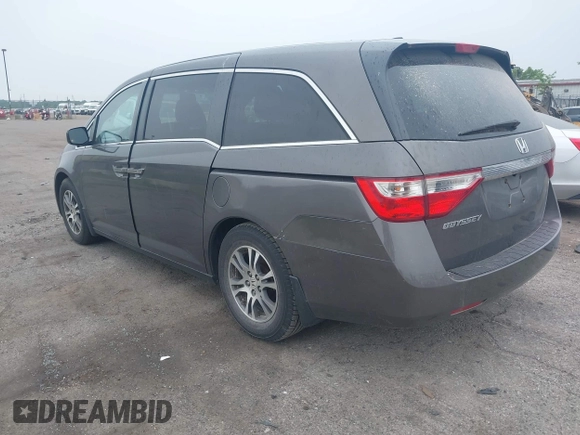 2011 Honda Odyssey EX-L with VIN 5FNRL5H64BB029087, listed as a IAAI auction lot 42508764 with 214,705 mi miles and . Bid and sale history available at DreamBid. Image 3.