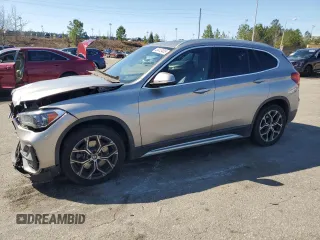 2021 BMW X1 sDrive28i with VIN WBXJG7C0XM5S33884, listed as a Copart auction lot 48413405 with 89,698 mi miles and Salvage Title. Bid and sale history available at DreamBid. Image 1.