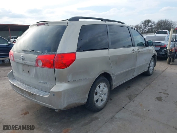 2010 Toyota Sienna CE with VIN 5TDKK4CC9AS311702, listed as a IAAI auction lot 41586415 with 206,453 mi miles. Bid and sale history available at carsss.com. Image 4.