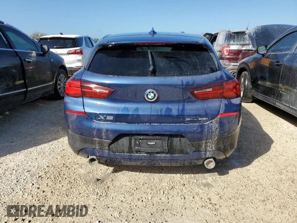 2021 BMW X2 sDrive28i with VIN WBXYH9C02M5S54591, listed as a Copart auction lot 77223834 with 0 mi miles and Salvage Title. Bid and sale history available at carsss.com. Image 6.