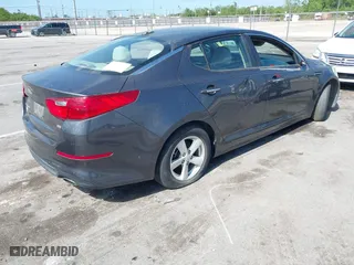 2015 Kia Optima LX with VIN KNAGM4A71F5634755, listed as a IAAI auction lot 42019729 with 101,064 mi miles. Bid and sale history available at carsss.com. Image 4.