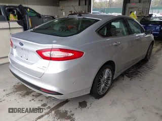 2013 Ford Fusion SE Hybrid with VIN 3FA6P0LU2DR319335, listed as a IAAI auction lot 42007573 with 135,099 mi miles. Bid and sale history available at carsss.com. Image 4.