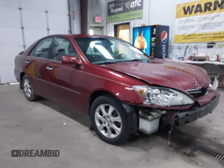 2005 Toyota Camry LE with VIN 4T1BF30KX5U099450, listed as a IAAI auction lot 41670099 with Not Provided miles and . Bid and sale history available at DreamBid. Image 1.