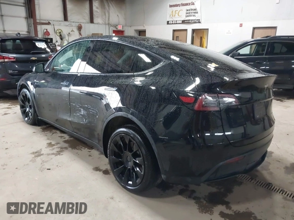 2023 Tesla Model Y Long Range with VIN 7SAYGDEE2PF808844, listed as a IAAI auction lot 41941905 with 39,951 mi miles and . Bid and sale history available at carsss.com. Image 3.