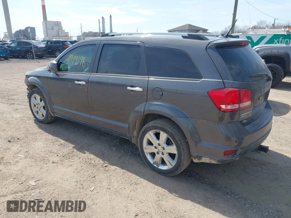 2014 Dodge Journey Limited with VIN 3C4PDDDG8ET199813, listed as a IAAI auction lot 41919196 with 199,096 mi miles and . Bid and sale history available at carsss.com. Image 3.