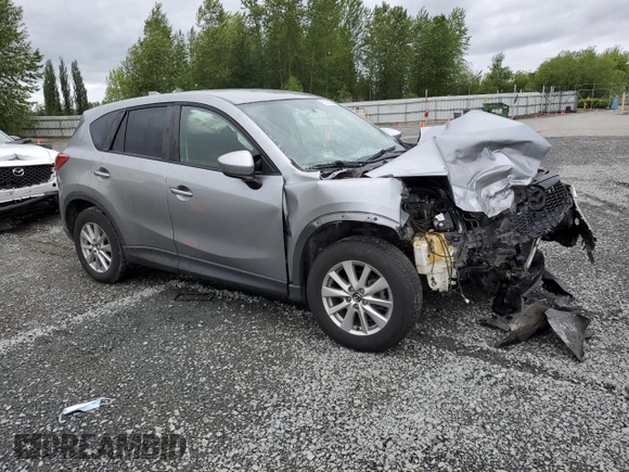 2014 Mazda CX-5 Touring z VIN JM3KE4CYXE0426408, wystawiony jako Copart lot #57355115 z przebiegiem Nie podano mil oraz Szkody całkowita. Historia ofert i sprzedaży dostępna na DreamBid. Obrazek 4.