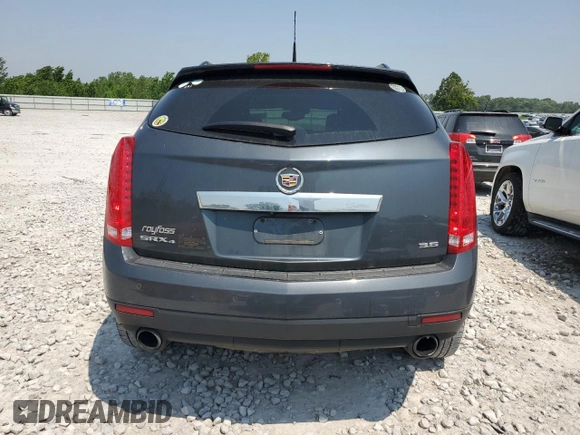 2013 Cadillac SRX Premium Collection с VIN 3GYFNJE33DS569034, выставлен на аукционе Copart как лот 60016355 с пробегом 117 595 миль миль и Чистый • Clean title. История ставок и продаж доступна на DreamBid. Изображение 6.