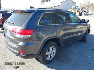 2017 Jeep Grand Cherokee Laredo with VIN 1C4RJEAG8HC944037, listed as a IAAI auction lot 41299619 with 140,405 mi miles. Bid and sale history available at carsss.com. Image 4.