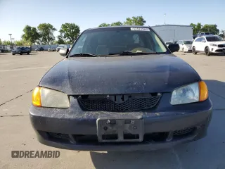 1999 Mazda Protege DX z VIN JM1BJ2227X0106522, wystawiony jako Copart lot #52423565 z przebiegiem 206 260 mil mil oraz Szkoda całkowita • Salvage title. Historia ofert i sprzedaży dostępna na DreamBid. Obrazek 5.