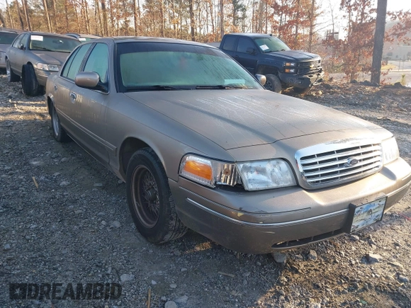2002 Ford Crown Victoria LX z VIN 2FAFP74W32X159473, wystawiony jako IAAI lot #41759610 z przebiegiem 86 523 mil mil oraz . Historia ofert i sprzedaży dostępna na DreamBid. Obrazek 1.