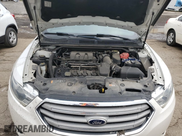 2015 Ford Taurus SEL z VIN 1FAHP2E89FG100466, wystawiony jako Copart lot #56887395 z przebiegiem 109 233 mil mil oraz Szkoda całkowita • Salvage title. Historia ofert i sprzedaży dostępna na DreamBid. Obrazek 11.
