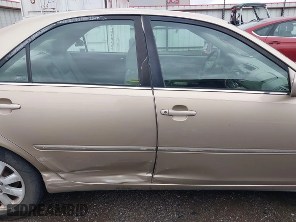 2002 Toyota Camry LE z VIN 4T1BE32K52U086150, wystawiony jako IAAI lot #42126685 z przebiegiem 175 212 mil mil oraz . Historia ofert i sprzedaży dostępna na DreamBid. Obrazek 13.