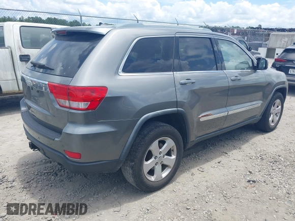 2011 Jeep Grand Cherokee Laredo with VIN 1J4RR4GG3BC595896, listed as a IAAI auction lot 42632333 with 135,426 mi miles and . Bid and sale history available at DreamBid. Image 4.