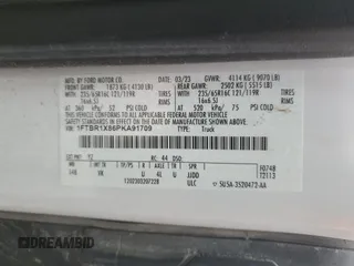 2023 Ford Transit Cargo with VIN 1FTBR1X86PKA91709, listed as a Copart auction lot 50389085 with 107,777 mi miles and Salvage title. Bid and sale history available at DreamBid. Image 14.