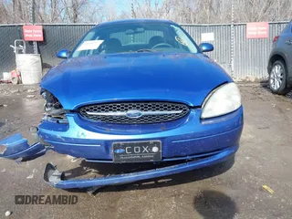 2003 Ford Taurus SE Standard with VIN 1FAFP53233G208763, listed as a IAAI auction lot 41661923 with 127,830 mi miles. Bid and sale history available at carsss.com. Image 13.