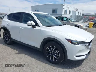 2018 Mazda CX-5 Touring with VIN JM3KFACM3J0381122, listed as a IAAI auction lot 42023838 with 76,121 mi miles. Bid and sale history available at carsss.com. Image 1.