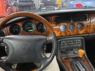 1997 Jaguar XK with VIN SAJGX5748VC006720, listed as a Copart auction lot 80928284 with 96,279 mi miles and Clean Title. Bid and sale history available at DreamBid. Image 9.