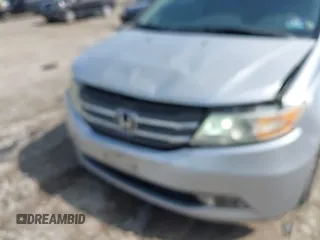 2012 Honda Odyssey EX-L with VIN 5FNRL5H61CB081634, listed as a IAAI auction lot 42760909 with 197,949 mi miles and . Bid and sale history available at DreamBid. Image 6.