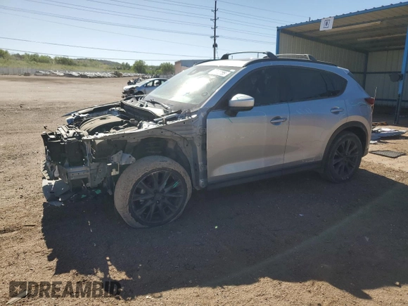2019 Mazda CX-5 Grand Touring with VIN JM3KFADM6K0543888, listed as a Copart auction lot 56310785 with 112,737 mi miles and Salvage title. Bid and sale history available at DreamBid. Image 1.