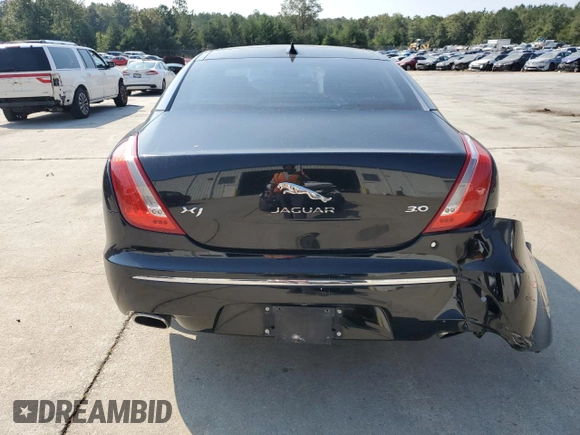2015 Jaguar XJ with VIN SAJWA1CZ7F8V83167, listed as a Copart auction lot 74991144 with 94,502 mi miles and Salvage Title. Bid and sale history available at carsss.com. Image 6.