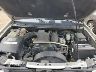 2005 GMC Envoy SLT with VIN 1GKDT13S152124404, listed as a Copart auction lot 64011494 with 212,951 mi miles and Salvage Title. Bid and sale history available at DreamBid. Image 11.