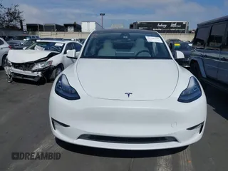2021 Tesla Model Y Long Range with VIN 5YJYGDEE3MF081304, listed as a IAAI auction lot 41706240 with 90,510 mi miles and . Bid and sale history available at DreamBid. Image 12.