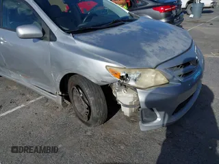2011 Toyota Corolla L with VIN JTDBU4EE7BJ108265, listed as a IAAI auction lot 41969221 with 104,273 mi miles. Bid and sale history available at carsss.com. Image 6.