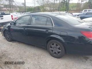 2010 Toyota Avalon XL with VIN 4T1BK3DB8AU358260, listed as a IAAI auction lot 41942640 with 230,584 mi miles and . Bid and sale history available at carsss.com. Image 14.