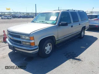 1999 Chevrolet Suburban with VIN 3GNEC16R9XG253081, listed as a IAAI auction lot 41719007 with 196,884 mi miles. Bid and sale history available at carsss.com. Image 2.