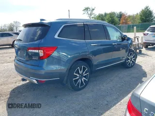 2020 Honda Pilot Touring 8-Passenger with VIN 5FNYF6H93LB034009, listed as a IAAI auction lot 42090993 with 73,325 mi miles and . Bid and sale history available at carsss.com. Image 4.