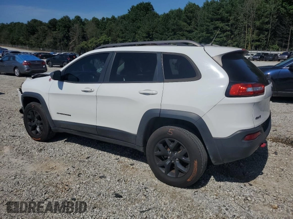 2015 Jeep Cherokee Trailhawk with VIN 1C4PJMBS0FW705288, listed as a Copart auction lot 61796275 with 133,874 mi miles and Salvage title. Bid and sale history available at DreamBid. Image 2.