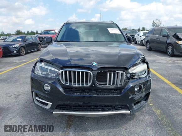 2016 BMW X5 xDrive50i with VIN 5UXKR6C51G0J81658, listed as a IAAI auction lot 41801382 with 34,572 mi miles. Bid and sale history available at carsss.com. Image 6.