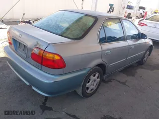 1999 Honda Civic EX with VIN 2HGEJ8640XH505636, listed as a IAAI auction lot 41629850 with 369,637 mi miles. Bid and sale history available at carsss.com. Image 4.