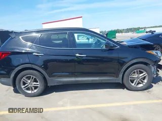 2017 Hyundai Santa Fe 2.4L z VIN 5NMZU3LB4HH024307, wystawiony jako IAAI lot #42147423 z przebiegiem 72 504 mil mil oraz . Historia ofert i sprzedaży dostępna na DreamBid. Obrazek 13.