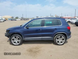 2012 Volkswagen Tiguan SEL with VIN WVGAV7AX8CW536752, listed as a IAAI auction lot 41798619 with 128,223 mi miles and . Bid and sale history available at DreamBid. Image 14.