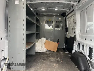2020 Ford Transit Cargo with VIN 1FTYE1C86LKB62039, listed as a IAAI auction lot 42599731 with 102,656 mi miles and . Bid and sale history available at DreamBid. Image 4.