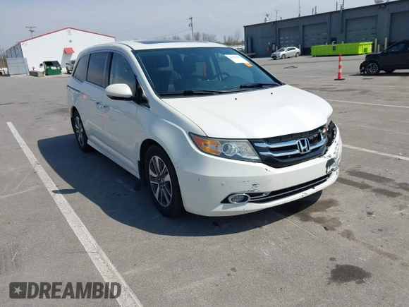 2016 Honda Odyssey Touring Elite with VIN 5FNRL5H97GB044278, listed as a IAAI auction lot 42056101 with 182,396 mi miles and . Bid and sale history available at DreamBid. Image 1.