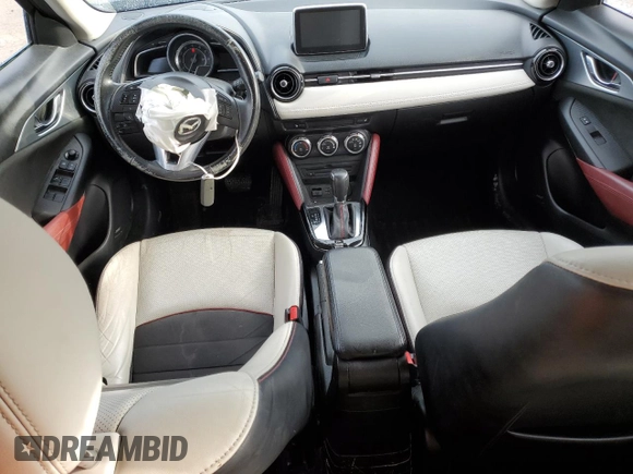 2017 Mazda CX-3 Grand Touring z VIN JM1DKFD75H0141048, wystawiony jako Copart lot #55752185 z przebiegiem 89 960 mil mil oraz Szkody całkowita. Historia ofert i sprzedaży dostępna na DreamBid. Obrazek 8.
