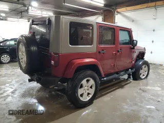 2007 Jeep Wrangler Unlimited Sahara with VIN 1J4GA59197L104784, listed as a Copart auction lot 56700205 with 156,382 mi miles and Salvage title. Bid and sale history available at DreamBid. Image 3.