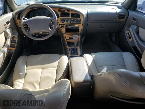 1996 Toyota Camry LE z VIN JT2BF12K3T0139807, wystawiony jako Copart lot #57675855 z przebiegiem 258 601 mil mil oraz Szkoda całkowita • Salvage title. Historia ofert i sprzedaży dostępna na DreamBid. Obrazek 8.
