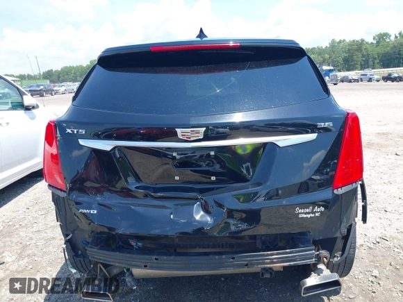 2018 Cadillac XT5 Premium Luxury AWD z VIN 1GYKNFRS3JZ112459, wystawiony jako IAAI lot #42590258 z przebiegiem 157 377 mil mil oraz . Historia ofert i sprzedaży dostępna na DreamBid. Obrazek 6.