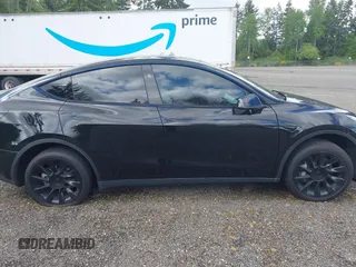 2023 Tesla Model Y Long Range z VIN 7SAYGDEE2PF885116, wystawiony jako IAAI lot #40091902 z przebiegiem 11 779 mil mil oraz . Historia ofert i sprzedaży dostępna na DreamBid. Obrazek 13.
