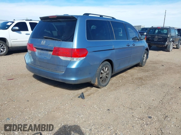 2010 Honda Odyssey EX-L with VIN 5FNRL3H7XAB052742, listed as a IAAI auction lot 41705935 with 205,190 mi miles and . Bid and sale history available at DreamBid. Image 4.