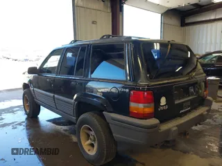 1995 Jeep Grand Cherokee Laredo z VIN 1J4GZ58Y3SC670696, wystawiony jako IAAI lot #42530934 z przebiegiem 165 658 mil mil oraz . Historia ofert i sprzedaży dostępna na DreamBid. Obrazek 3.