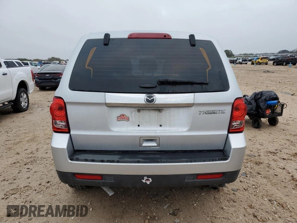 2011 Mazda Tribute Touring with VIN 4F2CY0C73BKM07056, listed as a Copart auction lot 85149404 with 138,265 mi miles and Salvage Title. Bid and sale history available at carsss.com. Image 6.