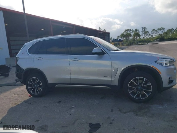 2018 BMW X5 xDrive40e iPerformance with VIN 5UXKT0C53J0V98060, listed as a IAAI auction lot 41456809 with 75,407 mi miles. Bid and sale history available at carsss.com. Image 14.