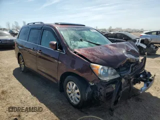 2010 Honda Odyssey EX-L with VIN 5FNRL3H60AB041353, listed as a Copart auction lot 52801315 with 120,253 mi miles and Salvage Title. Bid and sale history available at DreamBid. Image 4.